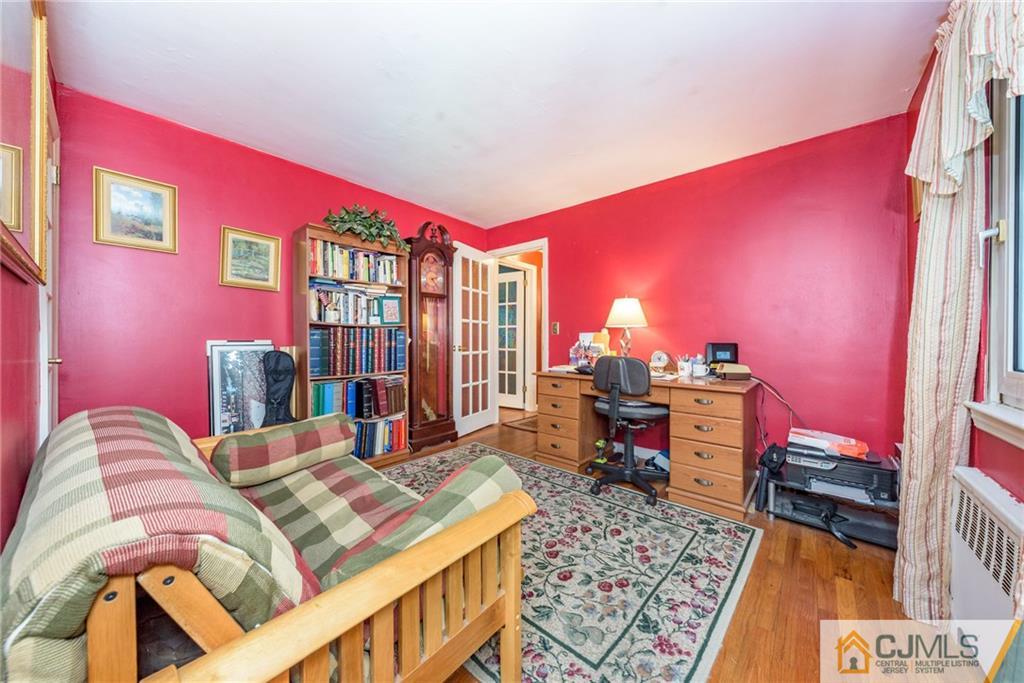 138 River Edge Road Bergenfield, NJ 07621 - Photo 17 of 28 a bed room with a bed and a desk