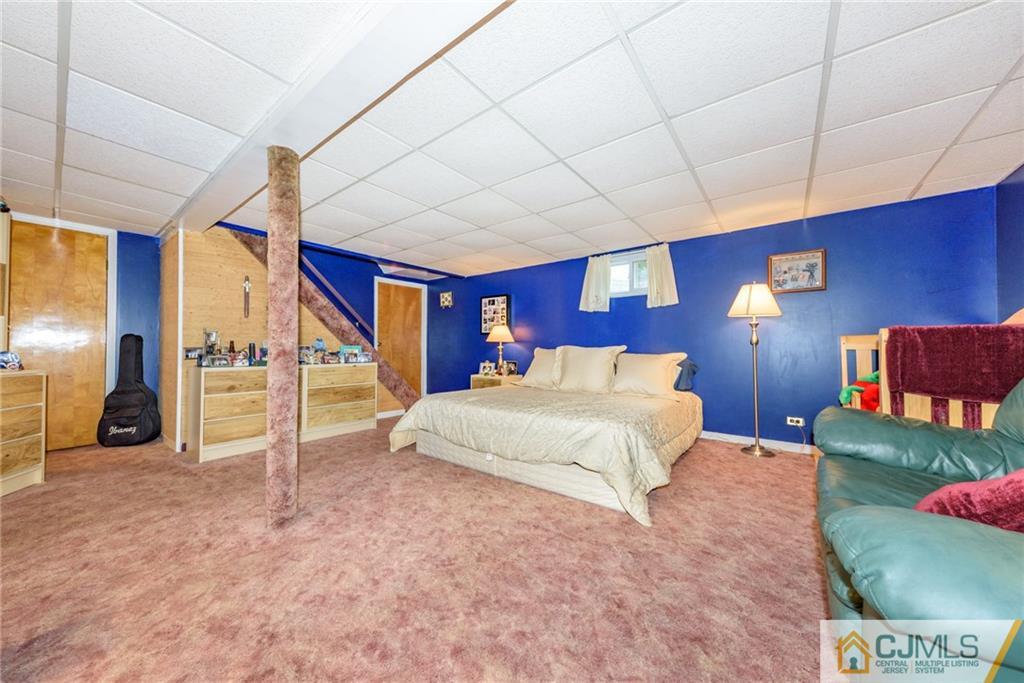 138 River Edge Road Bergenfield, NJ 07621 - Photo 21 of 28 a bed room with a bed and a large window