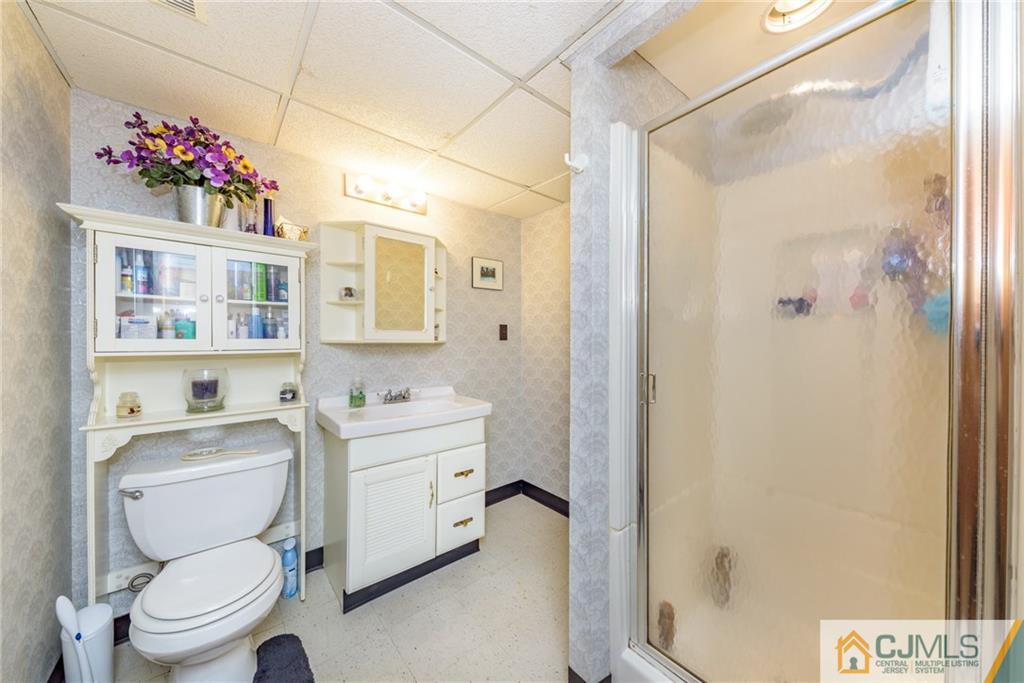 138 River Edge Road Bergenfield, NJ 07621 - Photo 24 of 28 a bathroom with a sink toilet vanity and shower