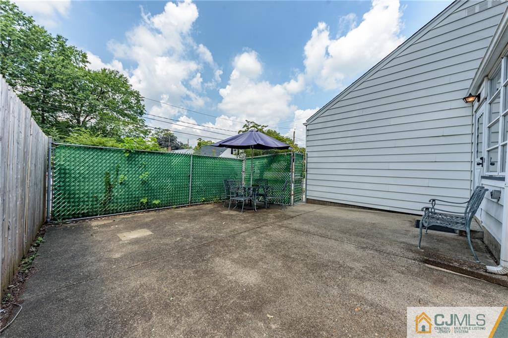 138 River Edge Road Bergenfield, NJ 07621 - Photo 26 of 28 a view of a porch with a table and a chairs