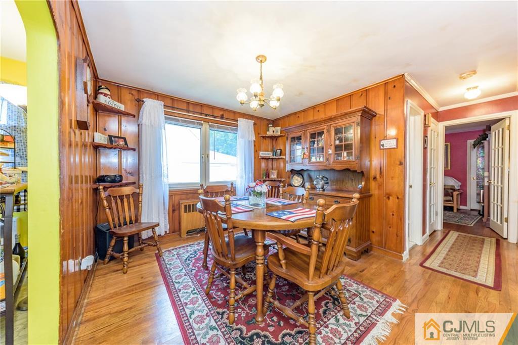 138 River Edge Road Bergenfield, NJ 07621 - Photo 6 of 28 a view of a dining room with furniture window and wooden floor