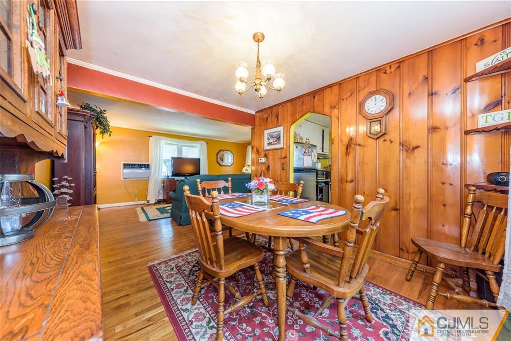 138 River Edge Road Bergenfield, NJ 07621 - Photo 7 of 28 a view of a dining room with furniture window and wooden floor