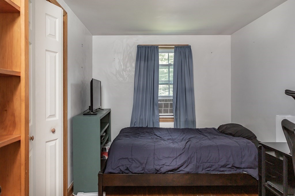109 Oak Street Raynham, MA 02767 - Photo 11 of 25 a bedroom with a bed and a window