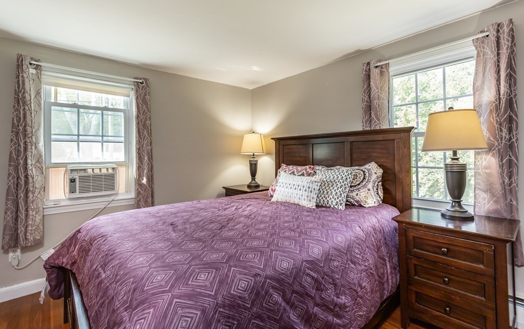 109 Oak Street Raynham, MA 02767 - Photo 13 of 25 a bedroom with a bed and a window
