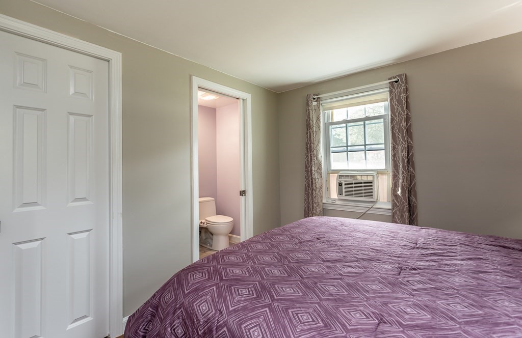 109 Oak Street Raynham, MA 02767 - Photo 14 of 25 a bedroom with a bed and a window