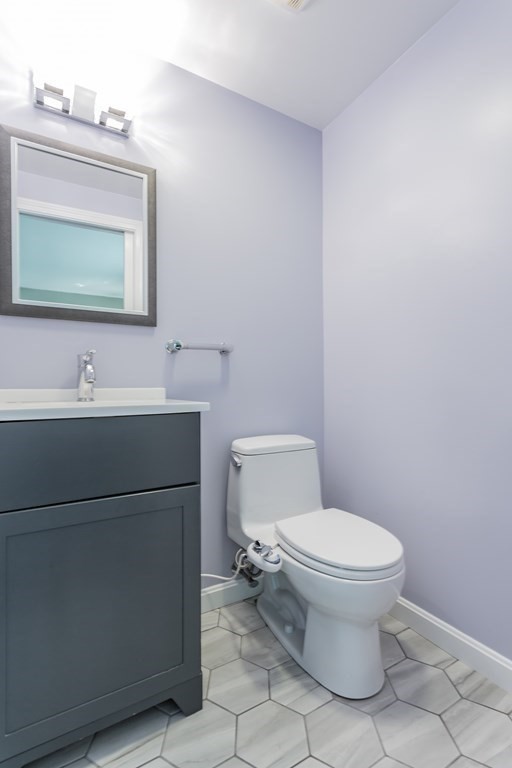 109 Oak Street Raynham, MA 02767 - Photo 15 of 25 a bathroom with a toilet sink and mirror