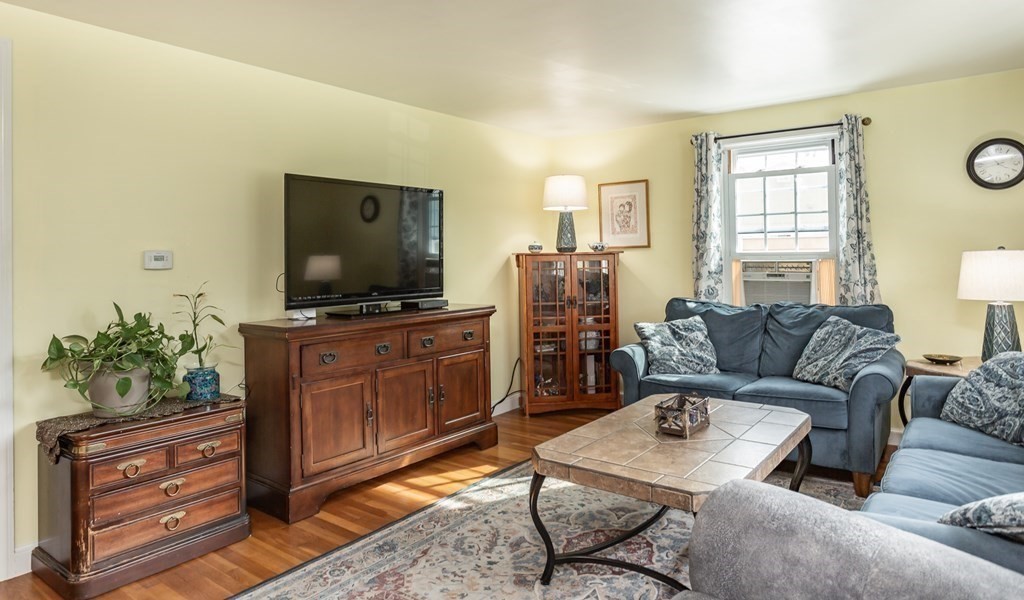 109 Oak Street Raynham, MA 02767 - Photo 9 of 25 a living room with furniture and a flat screen tv