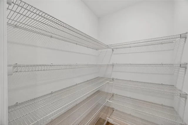 a kitchen with stainless steel appliances granite countertop a refrigerator stove microwave and sink