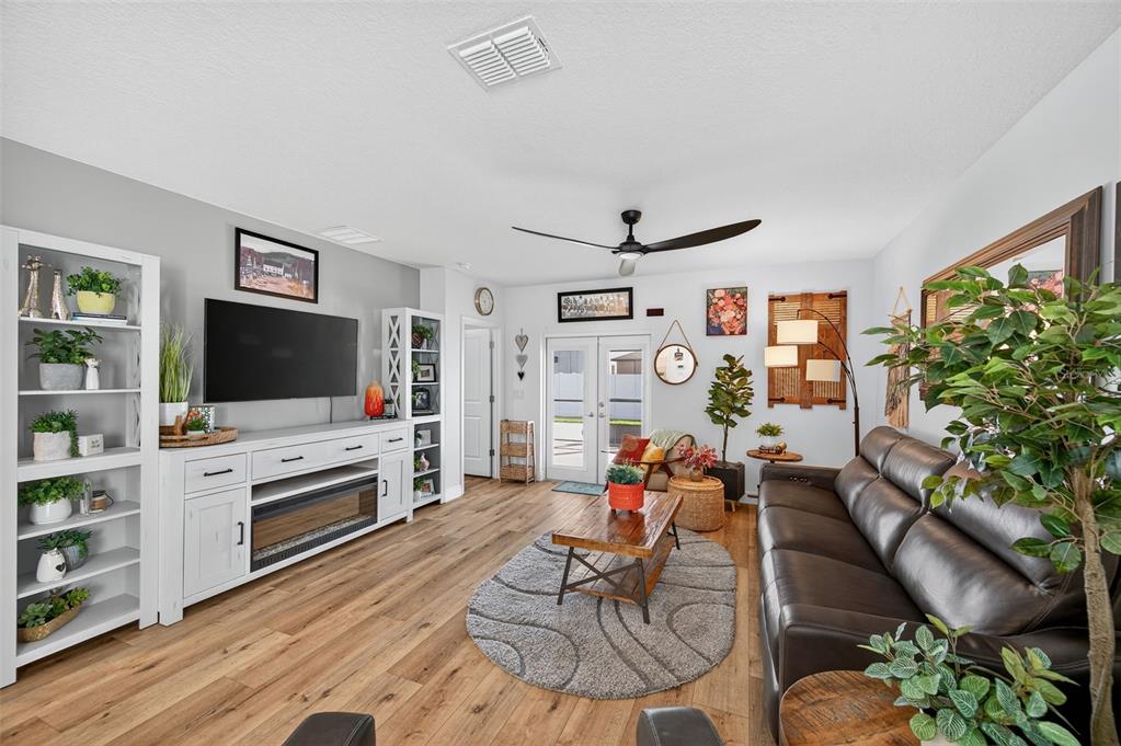 94 Rose Bud Ln Spring Hill Spring Hill, FL 34609 - Photo 14 of 38 a living room with furniture and a flat screen tv