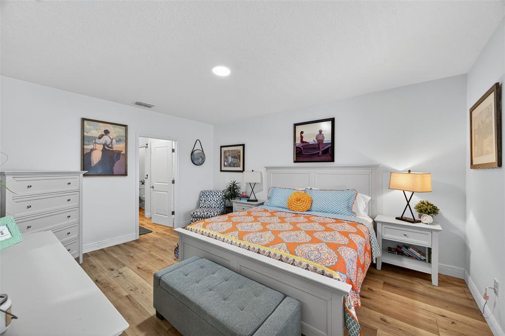 94 Rose Bud Ln Spring Hill Spring Hill, FL 34609 - Photo 15 of 38 a bedroom with a bed and a cabinets