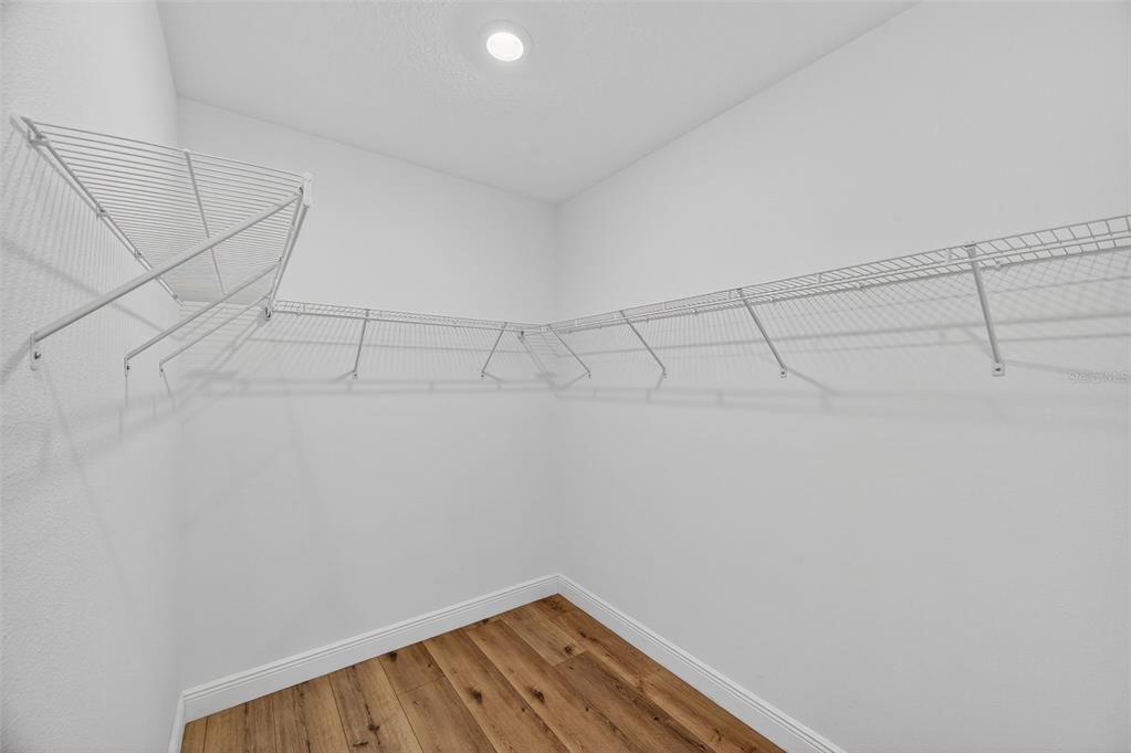 94 Rose Bud Ln Spring Hill Spring Hill, FL 34609 - Photo 20 of 38 a view of a room with racks on the wall