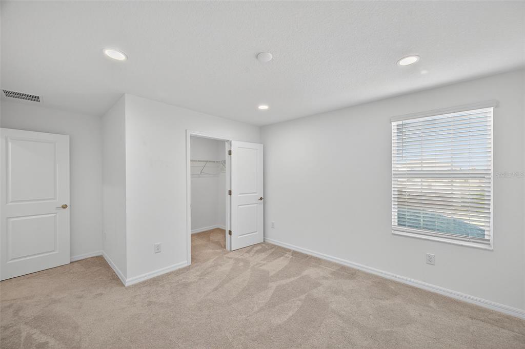 94 Rose Bud Ln Spring Hill Spring Hill, FL 34609 - Photo 23 of 38 a view of an empty room with a window