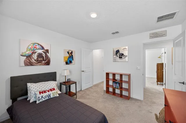 a view of a patio with a table and chairs under an umbrella