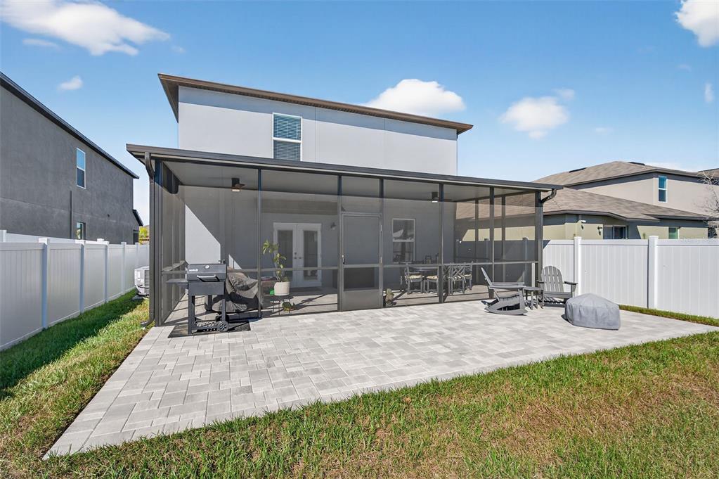 94 Rose Bud Ln Spring Hill Spring Hill, FL 34609 - Photo 35 of 38 a view of a patio with a table and chairs under an umbrella