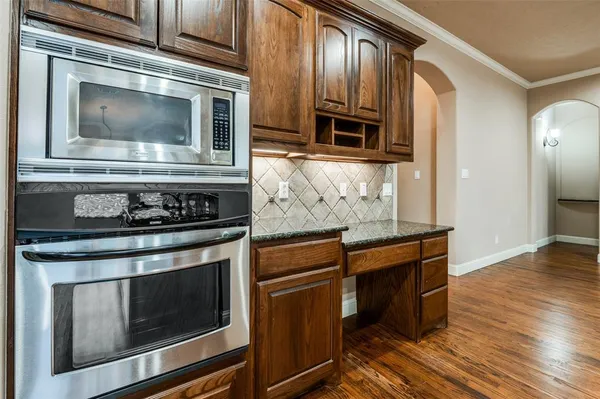 a view of kitchen with cabinets and wooden floor