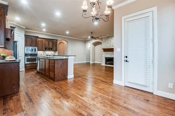 a work room with furniture and wooden floor