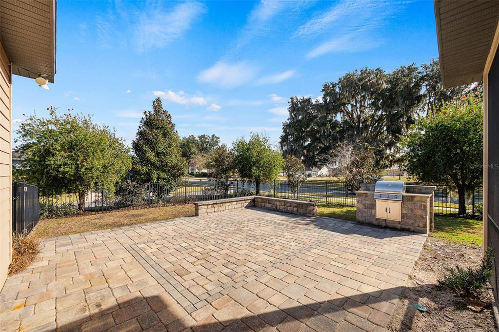 2779 Southwest 121st Drive Gainesville, FL 32608 - Photo 34 of 39 a swimming pool with outdoor seating and yard in back