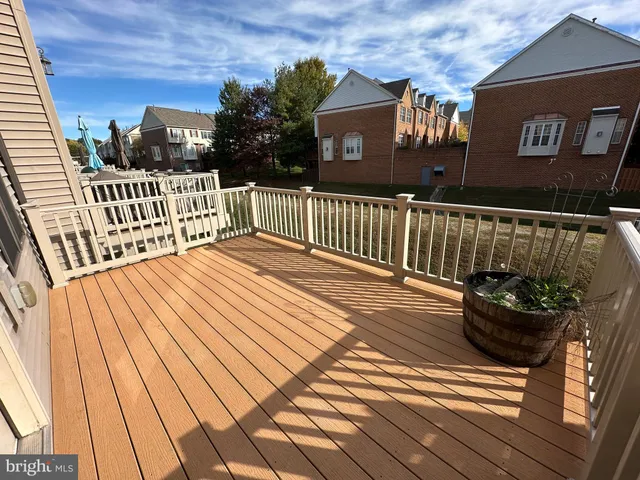a view of a house with wooden deck