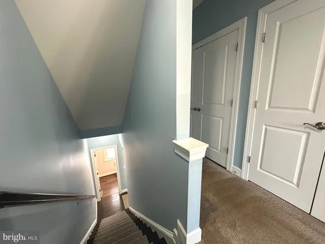 a view of a livingroom with a ceiling fan and window