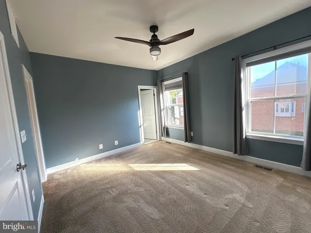 a bathroom with a sink double vanity granite tub shower and a mirror