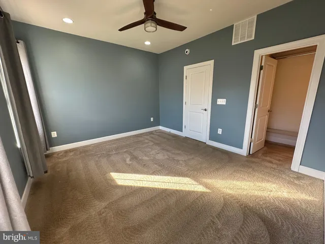 a bathroom with a sink vanity granite and toilet