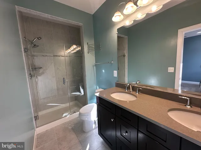 wooden floor and closet in a bathroom