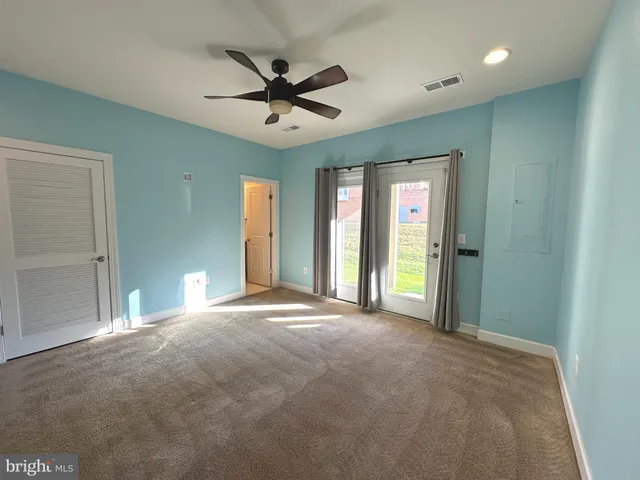 a bathroom with a granite countertop toilet sink and shower