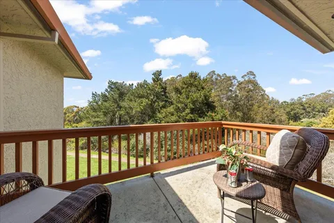 a view of a balcony with an outdoor space