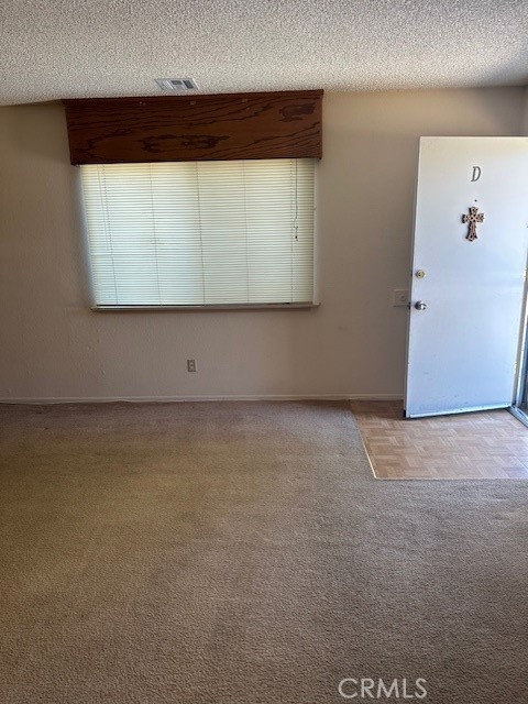 14966 Ritter Street, Unit D Victorville, CA 92394 - Photo 3 of 6 a view of a room with wooden floor