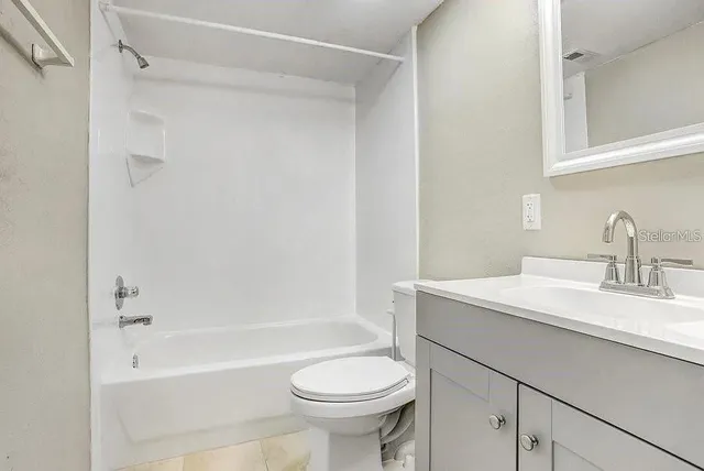 a bathroom with a sink a toilet and a bathtub