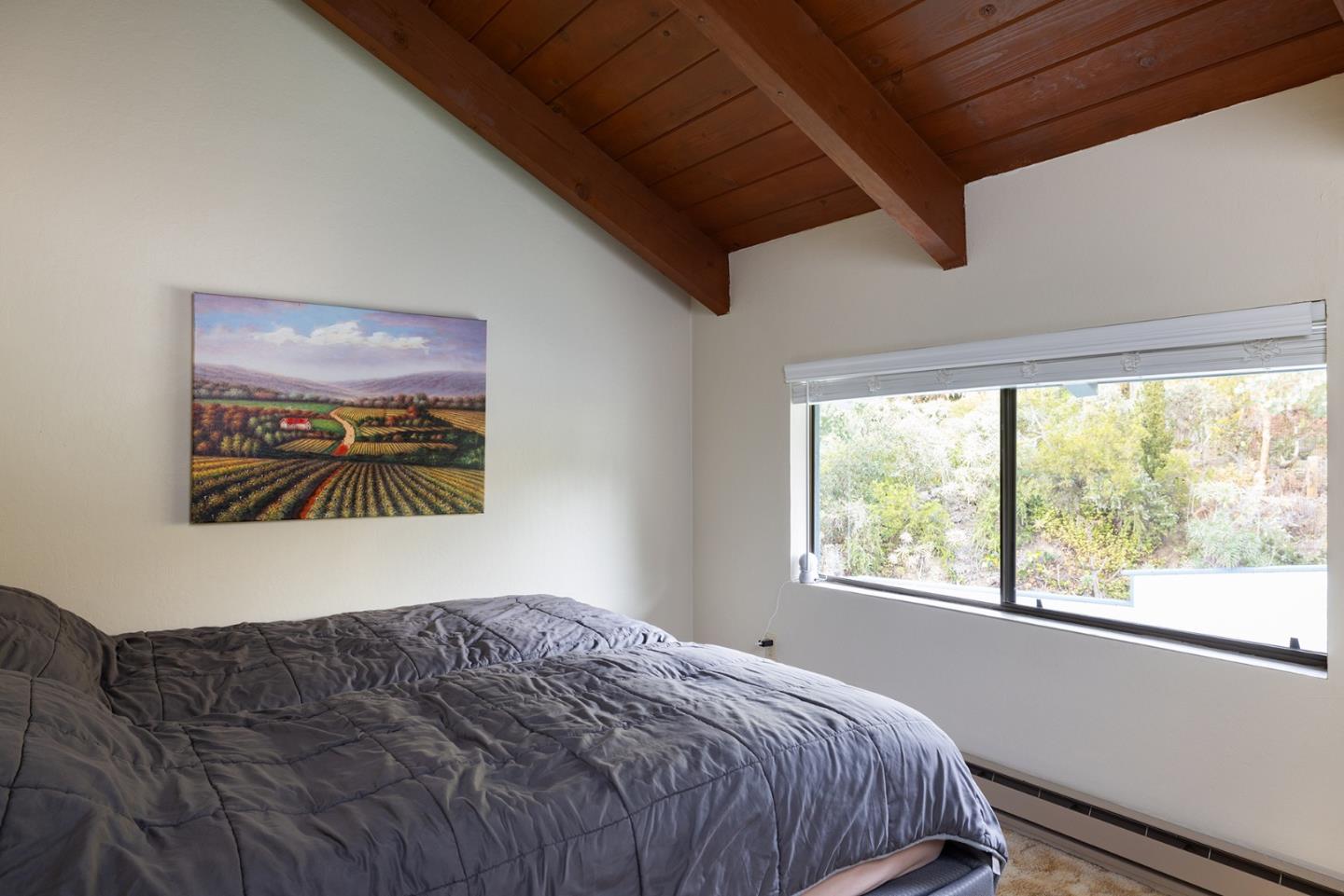 530 Quail Run Road Aptos, CA 95003 - Photo 22 of 25 a bedroom with a bed and a window