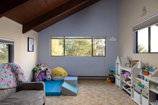 a bedroom with furniture and a window