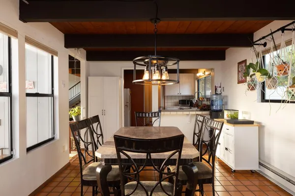 a dining room with furniture and window