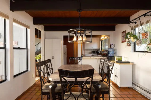 a dining room with furniture and window