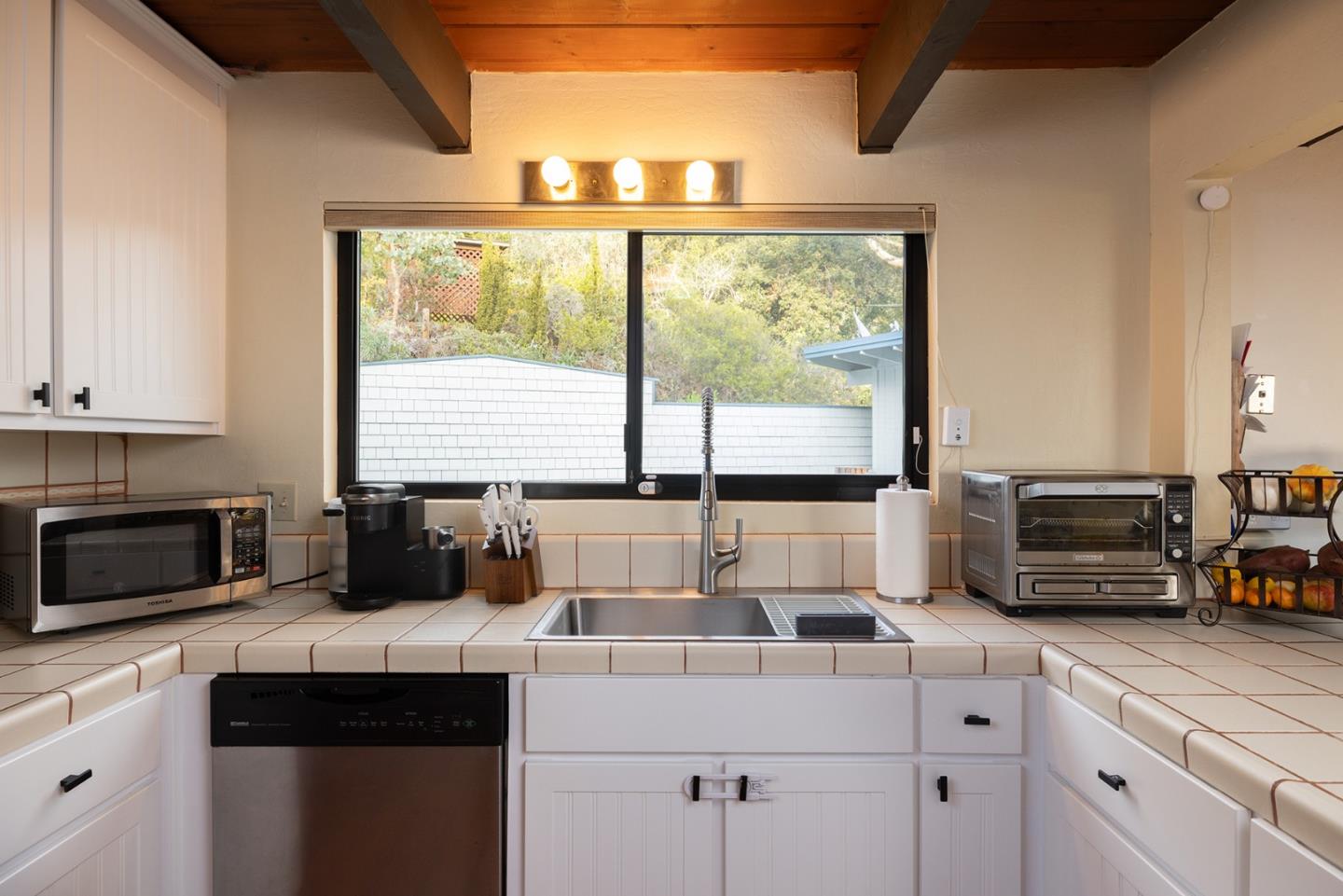 530 Quail Run Road Aptos, CA 95003 - Photo 10 of 25 a kitchen with a stove a sink and a microwave