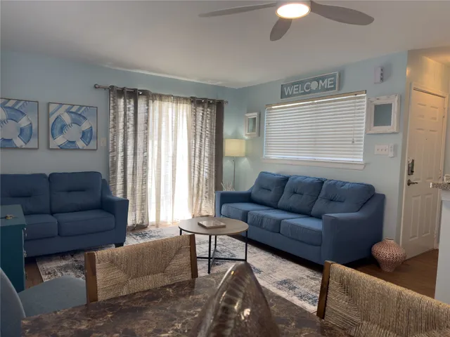 a living room with furniture and a window
