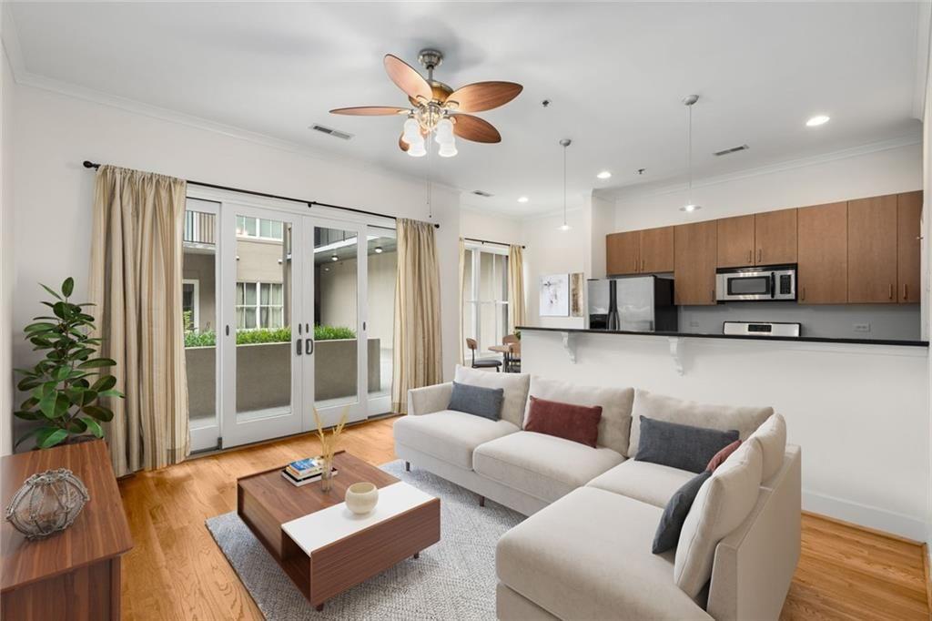 a living room with furniture and a large window