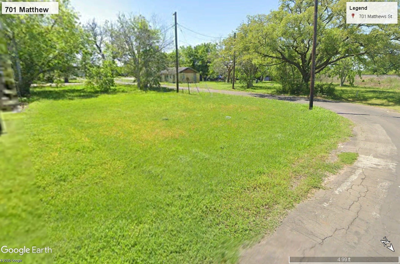 701 Matthews Street Bay City, TX 77414 - Photo 2 of 6 a view of a yard with a tree