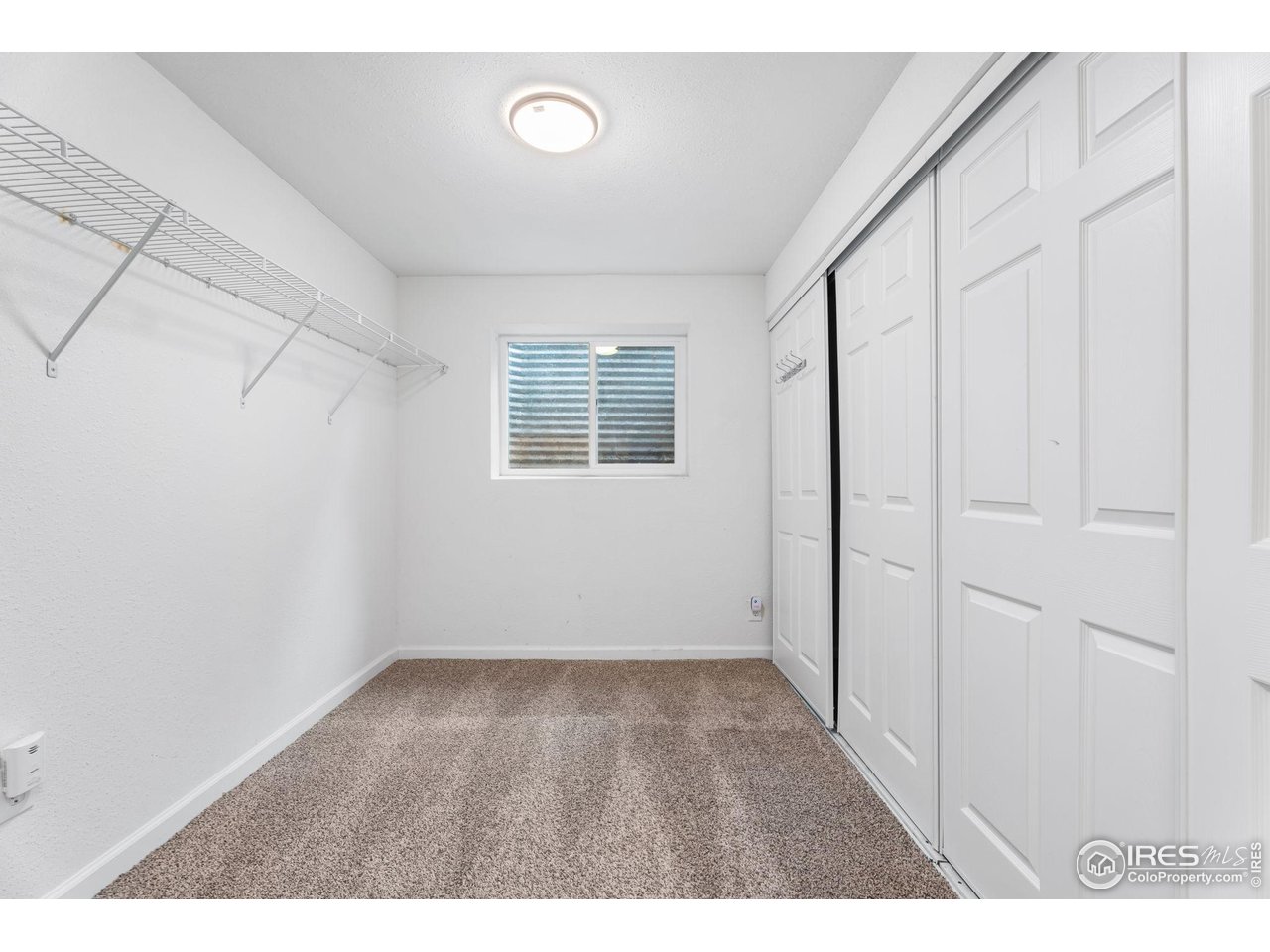 3036 Rustic Court Fort Collins, CO 80526 - Photo 24 of 29 Basement Bed Walk-In Closet