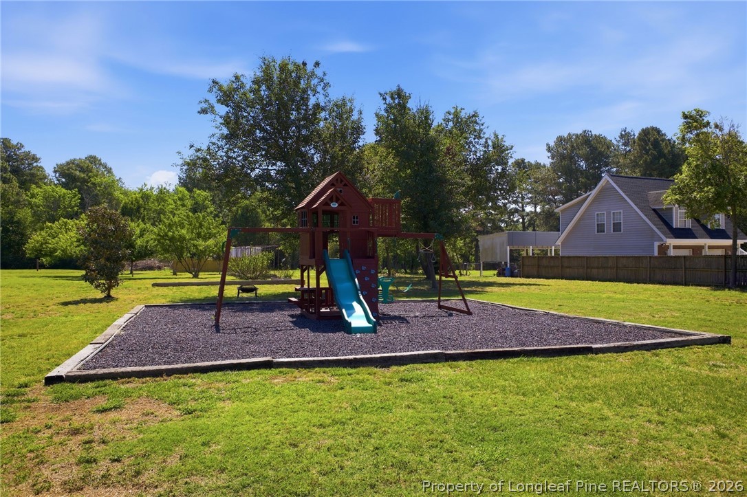 2589 June Johnson Road Raeford, NC 28376 - Photo 40 of 49 a view of a house with a yard