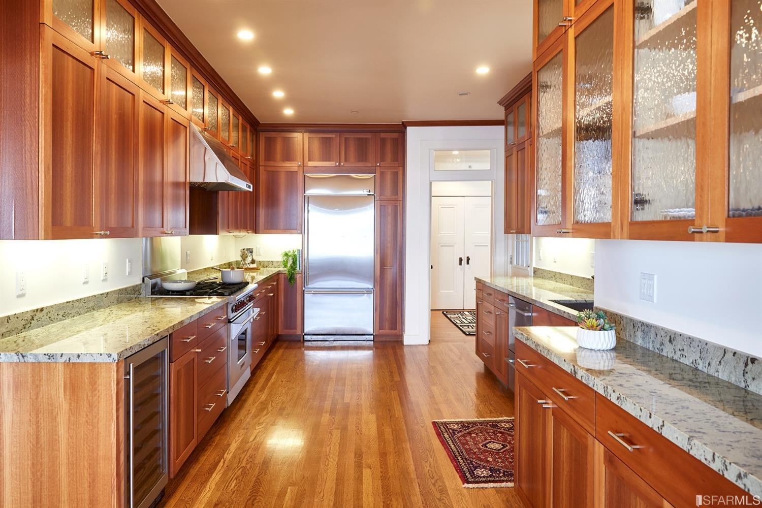 2444 Broadway San Francisco, CA 94115 - Photo 17 of 57 a kitchen with stainless steel appliances granite countertop sink stove top oven and cabinets