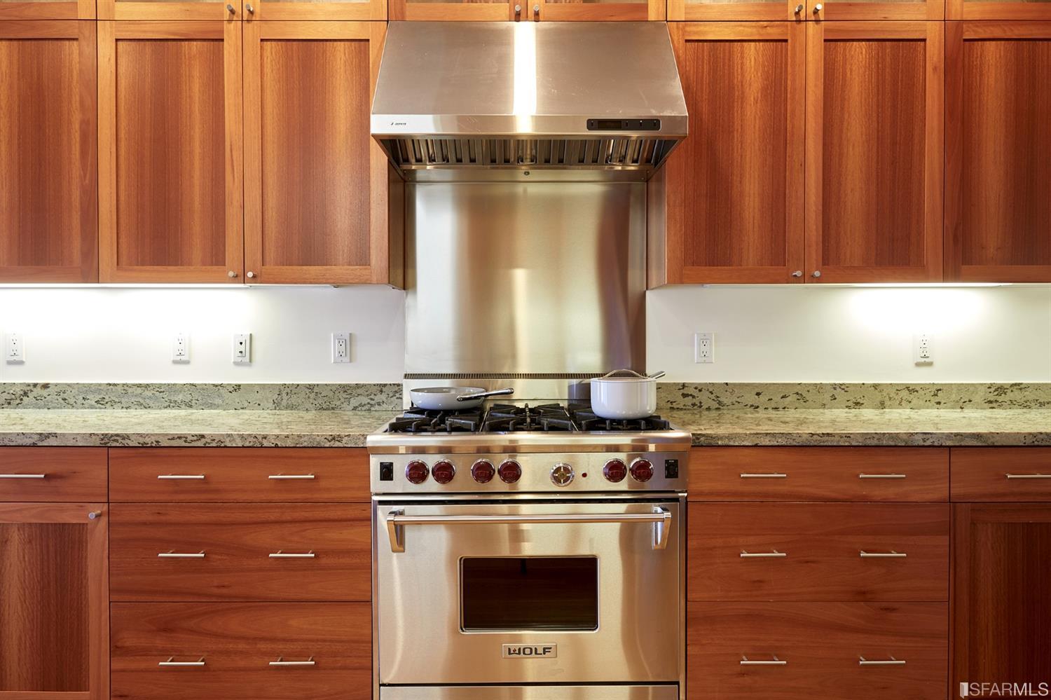 2444 Broadway San Francisco, CA 94115 - Photo 18 of 57 a stove top oven sitting inside of a kitchen