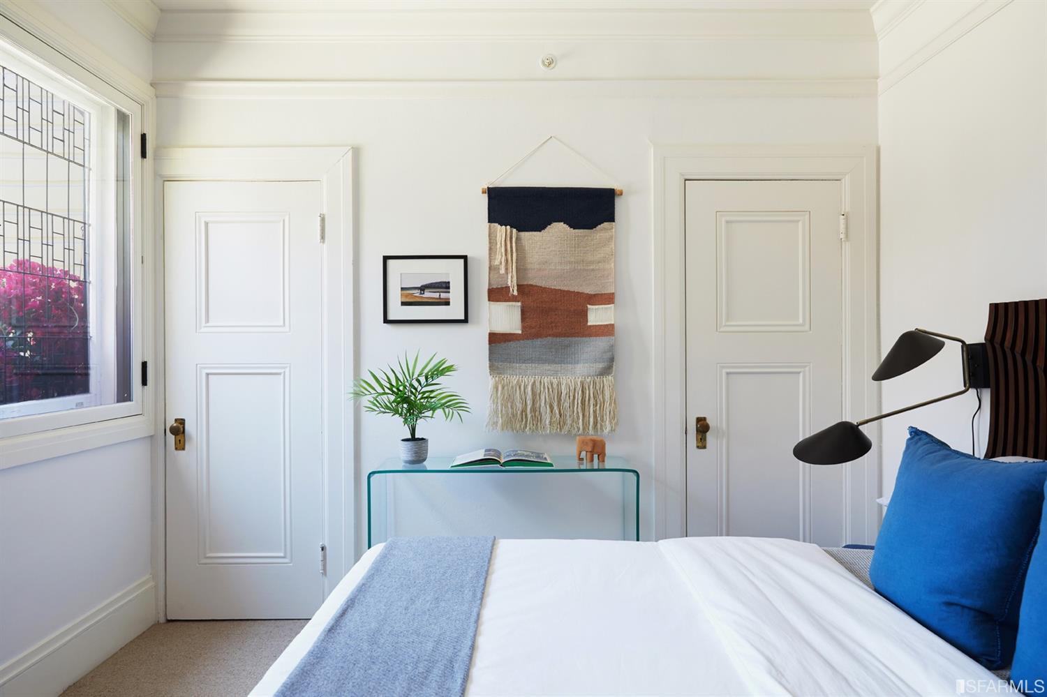 2444 Broadway San Francisco, CA 94115 - Photo 21 of 57 a bedroom with a bed and a cabinets