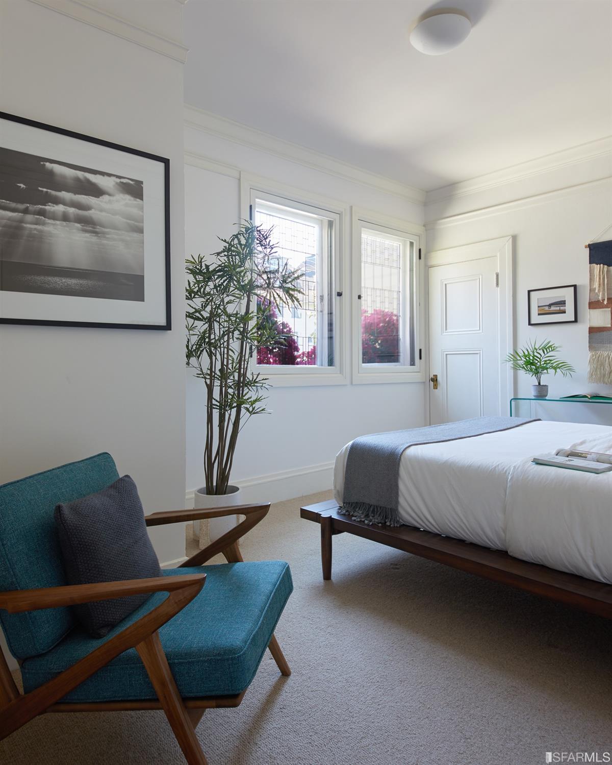 2444 Broadway San Francisco, CA 94115 - Photo 22 of 57 a bedroom with a bed couch and window