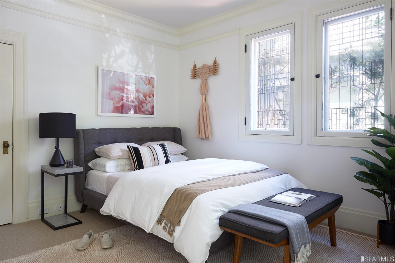 2444 Broadway San Francisco, CA 94115 - Photo 24 of 57 a bedroom with a bed and a lamp with window