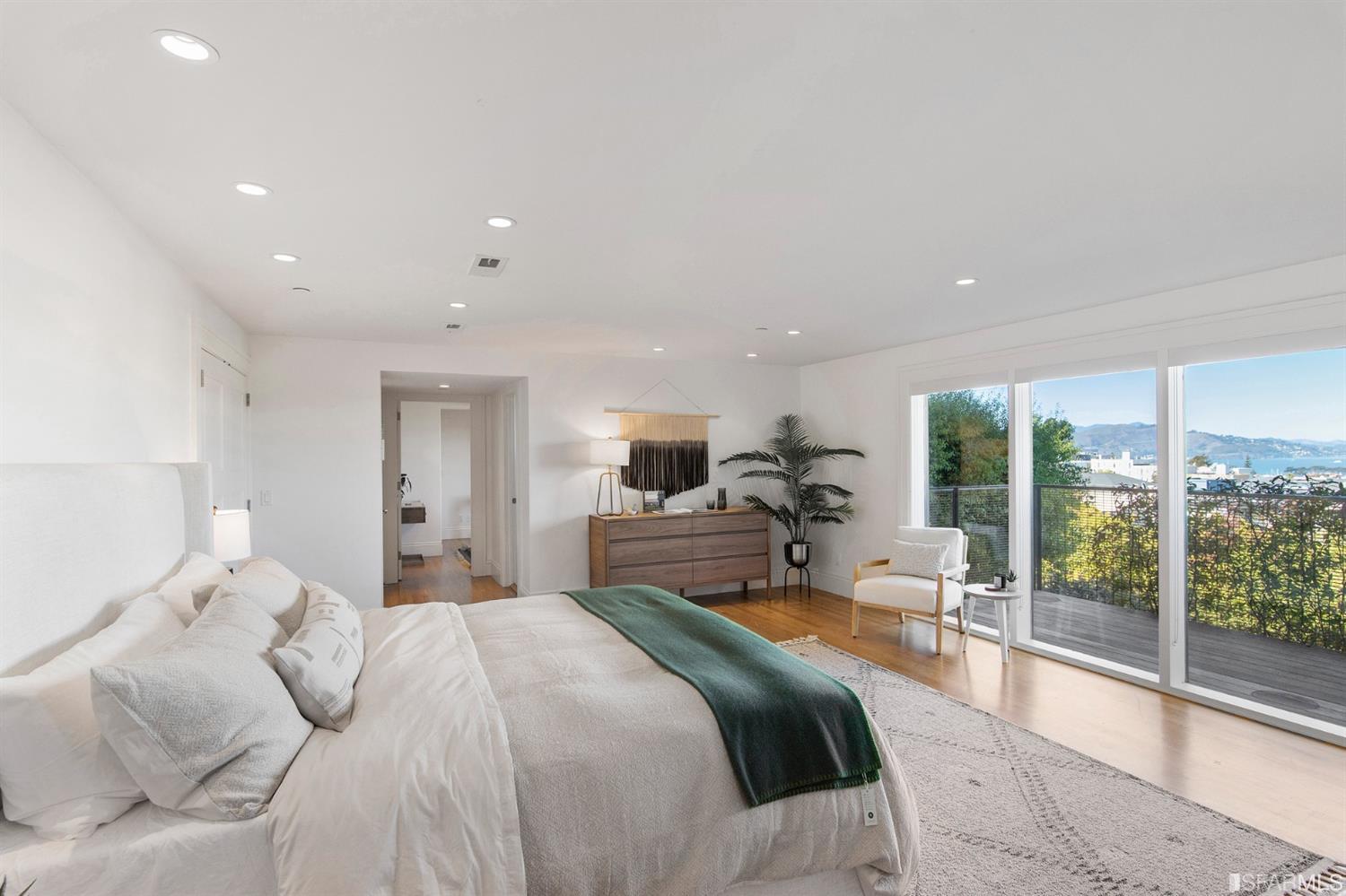 2444 Broadway San Francisco, CA 94115 - Photo 32 of 57 a bedroom with a large bed and a large window