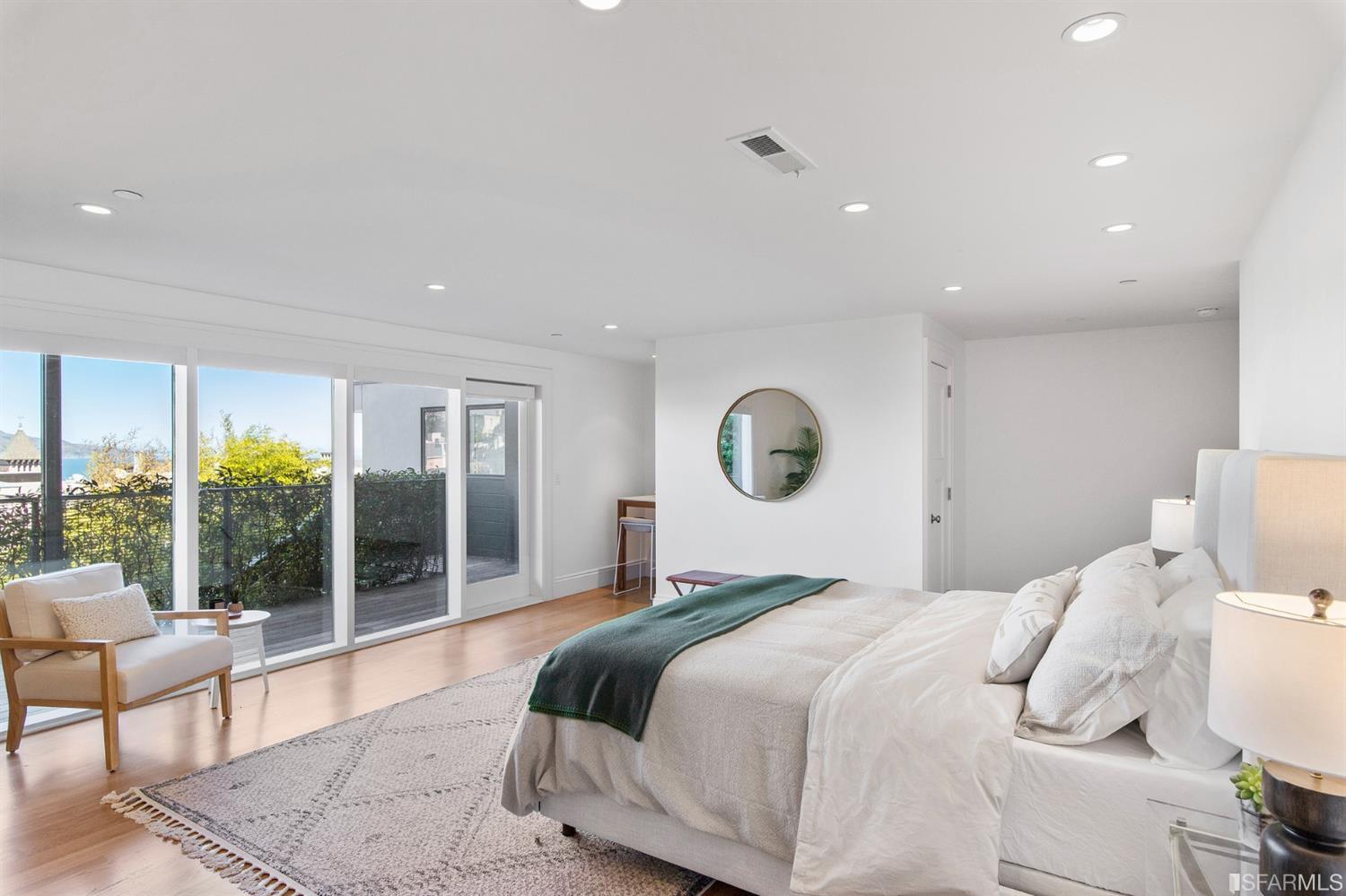 2444 Broadway San Francisco, CA 94115 - Photo 33 of 57 a bedroom with a large bed and a large window