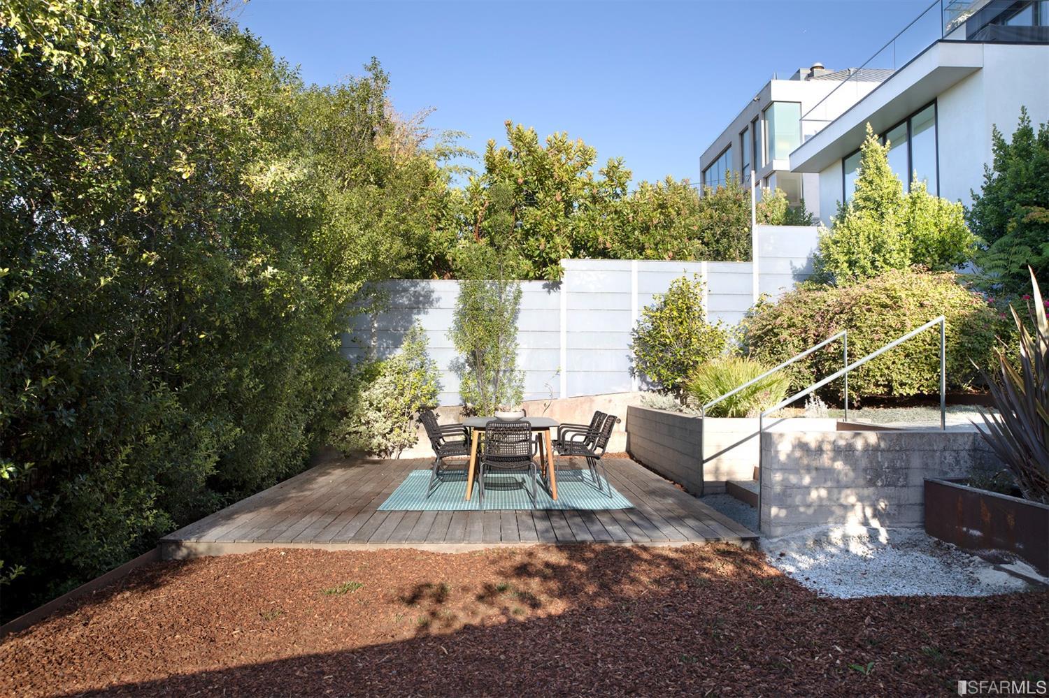 2444 Broadway San Francisco, CA 94115 - Photo 46 of 57 a view of a patio with table and chairs and potted plants