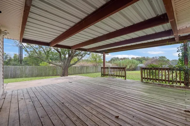 a view of a patio with wooden floor