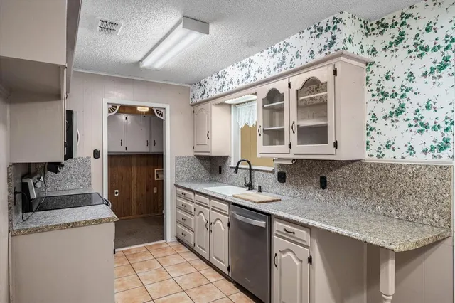 a kitchen with a sink stove and refrigerator